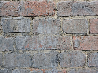 Background, old brick wall covered with frost