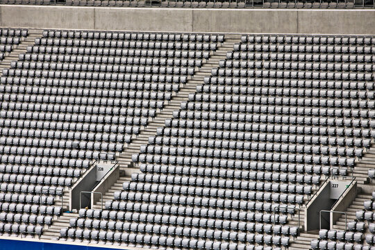 Rows of empty stadium seats.