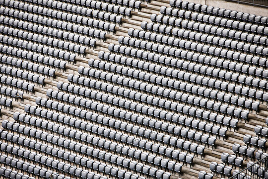 Rows of empty stadium seats.
