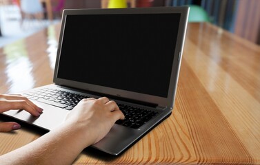 Fototapeta na wymiar Hand of young teacher or student on laptop keyboard