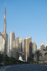 Futuristic and modern commercial and residential highrise tower skyscraper architecture with glass facades and clean lines in downtown Dubai, United Arab Emirates for millionaires and high society