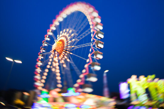 colorful bright ferris wheel ride at a folk festival