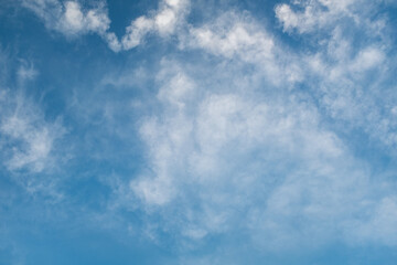 Sky background for celebration and season decoration. Light blue sky with white clouds for publication, design, poster, calendar, post, screensaver, wallpaper, cover, website. High quality photo