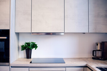 Part of a kitchen interior with a built-in induction hob
