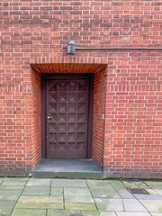 large secure door in a brick wall