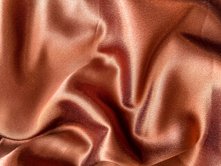 A close-up of brown satin as a background