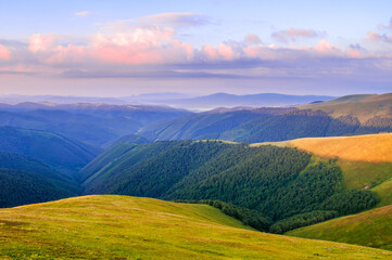 The view at dawn from the top of the mountain on distant mountains and valleys. Ukrainian...