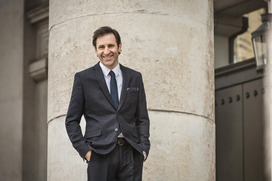 Business man in a suit looking into the camera. Munich, Germany