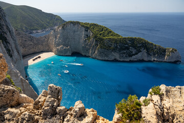 Fototapeta premium Aerial view of Navagio beach on Zakynthos island, Greece. Shipwreck Beach or Agios Georgios. is exposed cove in the Ionian Islands of Greece. Shipwreck on the beach in Zakynthos island, Greece.