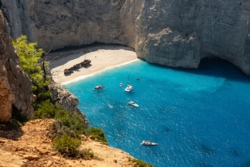 Obraz premium Aerial view of Navagio beach on Zakynthos island, Greece. Shipwreck Beach or Agios Georgios. is exposed cove in the Ionian Islands of Greece. Shipwreck on the beach in Zakynthos island, Greece.
