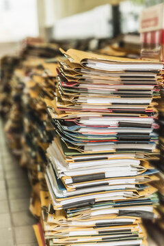 Still life of stacks of old documents and folders ready to be shredded and thrown away. Munich, Germany