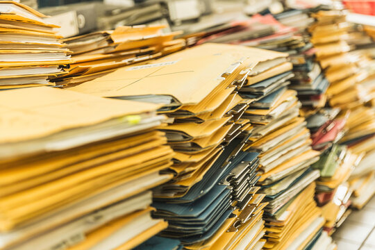 Still life of stacks of old documents and folders ready to be shredded and thrown away. Munich, Germany