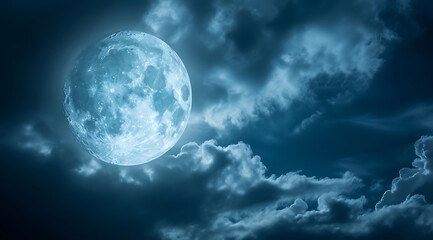 Obraz na płótnie Canvas a full moon is shown behind clouds in