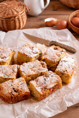 Classic sponge cake with apples on table, selective focus. Homemade cake