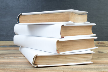 open book, books on the background school board. Back to school. Education. Copy space for text.