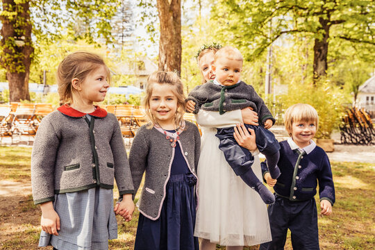 Group of kids posing together as a group after a confirmation celebration. Munich, Germany