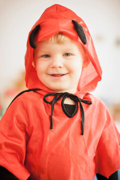 Young boy dressed in a devils costume looking into the camera during carnival season. Munich, Germany