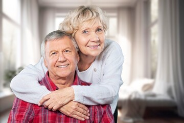 Portrait of senior couple posing at home