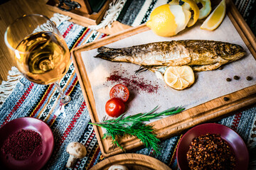 Mediterranean food, smoked Herring fish served with green onion,lemon,cherry tomatoes,spices,bread...