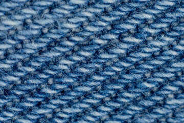 Extreme close-up blue denim fabric fibers texture background macro