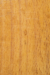 Close-up wooden cutting board desk texture background rustic cut marks wood knots