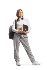 Female teenage student with backpack and books