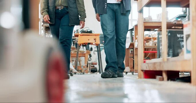 Legs, woodwork and people walking in carpentry workshop together for production or manufacturing. Partner, furniture stock and employee team in studio for art, creative or design for labor project