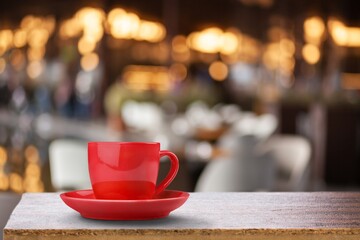 Wooden table at coffee shop  with a cup