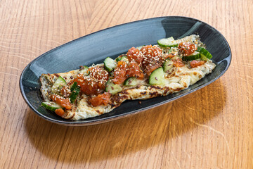 Omelette with salmon and cucumber