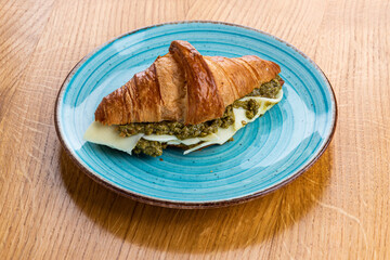 Sandwich croissant with pesto