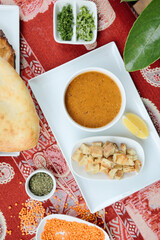 Table Decorated With Platters of Food and Various Dipping Sauces