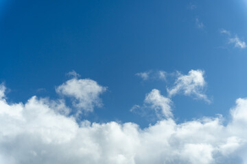 Bright Blue Sky with White Cotton Clouds