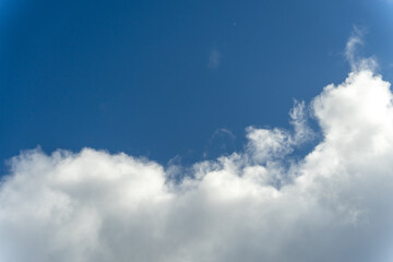 Bright Blue Sky with White Cotton Clouds