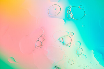 Iridescent colorful abstract background with bubbles, fluid texture pastel tones curvy wavy good vibes