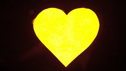 Sign template isolated on black background. Neon yellow social media symbol in the form of a heart glowing in the dark. Symbols for advertising projects or screensavers.