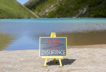 Term life insurance symbol. Concept words Term life insurance on beautiful black chalk blackboard....