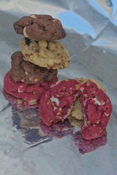 Tower of chocolate chip cookies on metallic foil