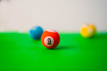 billiard balls on a green background