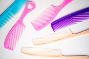 multi-colored hair combs on a white background