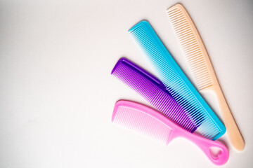 multi-colored hair combs on a white background