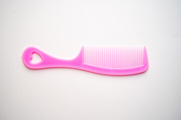 multi-colored hair combs on a white background