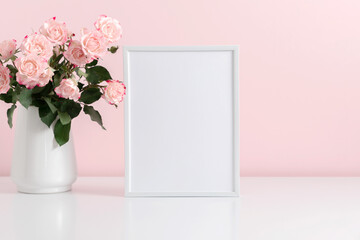 Blank frame for text, pink rose flowers on pastel pink background. Valentines Day, Easter, Birthday, Happy Women's Day, Mother's day. Front view.