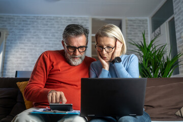 Couple upset headache depressed from family cost got higher holding receipts from supermarket with...