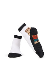 Close-up shot of  nylon socks, adorned with knitted bear insertion.The pair socks is isolated on a white background. Side and front view. Cozy hosiery for ladies and girls.