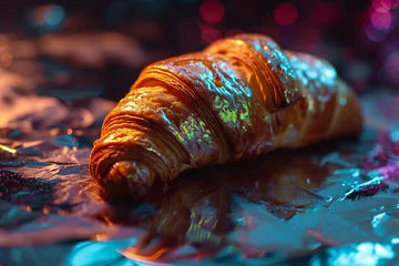  Pastry butter croissant made out of glass with holographic syrup on black background. Croissants in caramel glaze with holographic syrup close-up. Composition of desserts on table. © Stas