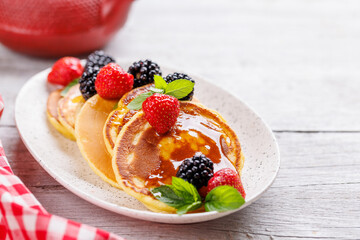 Tasty homemade pancakes with berries