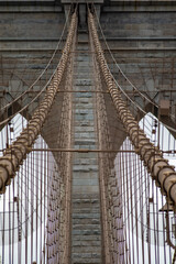 Obraz premium Spectacular photo of the Brooklyn Bridge linking the boroughs of Manhattan and Brooklyn in New York City (USA). It was the largest suspension bridge in the world, record span until 1889.