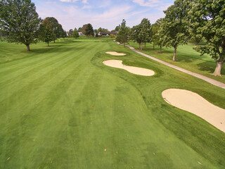 Aerial Serene Golf Course with Mature Trees and Sand Bunkers in Fort Wayne