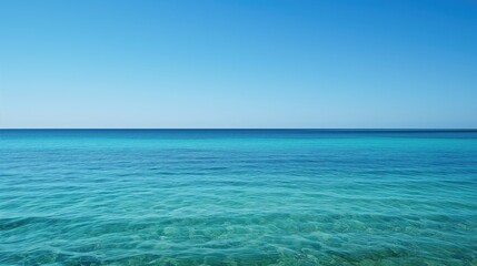 Beautiful ocean horizon line with clear blue sky