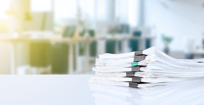 stack of reporting paper documents on a business table in the office, business documents for annual reports. Business analytics. Business office concept, soft focus.